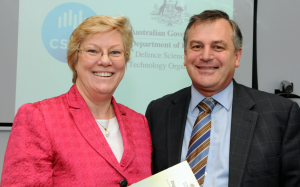 DSTO Chief Defence Scientist Dr Alex Zelinsky and CSIRO Chief Executive Megan Clark sign the agreement. Image credit: CSIRO media release