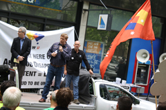 Invest in jobs: AMWU Victorian secretary Steve Dargavel talks to the crowd outside Liberal party hq in Melbourne.