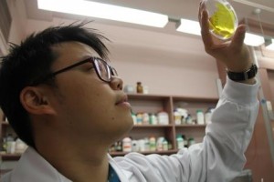 Dr Sam Lau holding up a plastic membrane that has received a ‘shot of botox’. Image credit: www.csiro.au