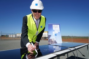 ARENA CEO Ivor Frischknecht signs the first solar panel to be installed at the Nyngan solar plant Image credit: http://arena.gov.au/project/agl-solar-project/