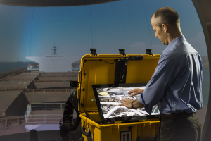 The GMR display provides a shared visual space, allowing the off-site expert to demonstrate what needs to be done using a pair of virtual hands. Image credit: www.csiro.au