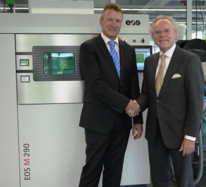 Pascal Boillat (left), Head of GF Machining Solutions with Dr Hans J. Langer (right), Founder and CEO of EOS Group in front of an EOS M 290 metal Additive Manufacturing system Image credit: EOS website