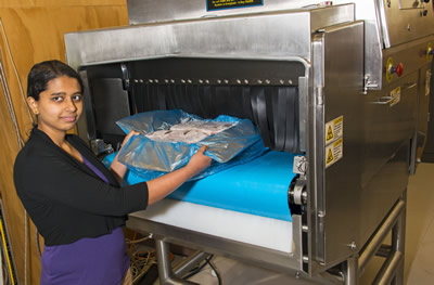 GNS Science technician Tushara Prakash with an Eagle-FA meat scanner Image credit: www.gns.cri.nz
