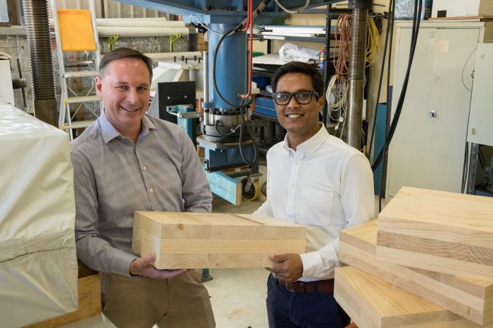 Paul Kremer and Associate Professor Mahmud Ashraf with laminated wood research