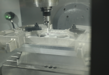 How Conturo Prototyping are delivering complex prototypes faster with the Fusion 360 Machining Extension Customer image from Conturo Prototyping showing their use of Fusion 360 and the Fusion 360 Machining Extension. Image shows the inside of a CNC machine as it uses a spindle-mounted probe to take measurements on a component.